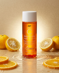 Boots Vitamin C Brightening Water Essence - Flacon entouré d'agrumes